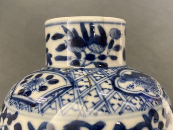 A Chinese blue and white five-piece garniture with peacocks, Kangxi mark, 19th C.